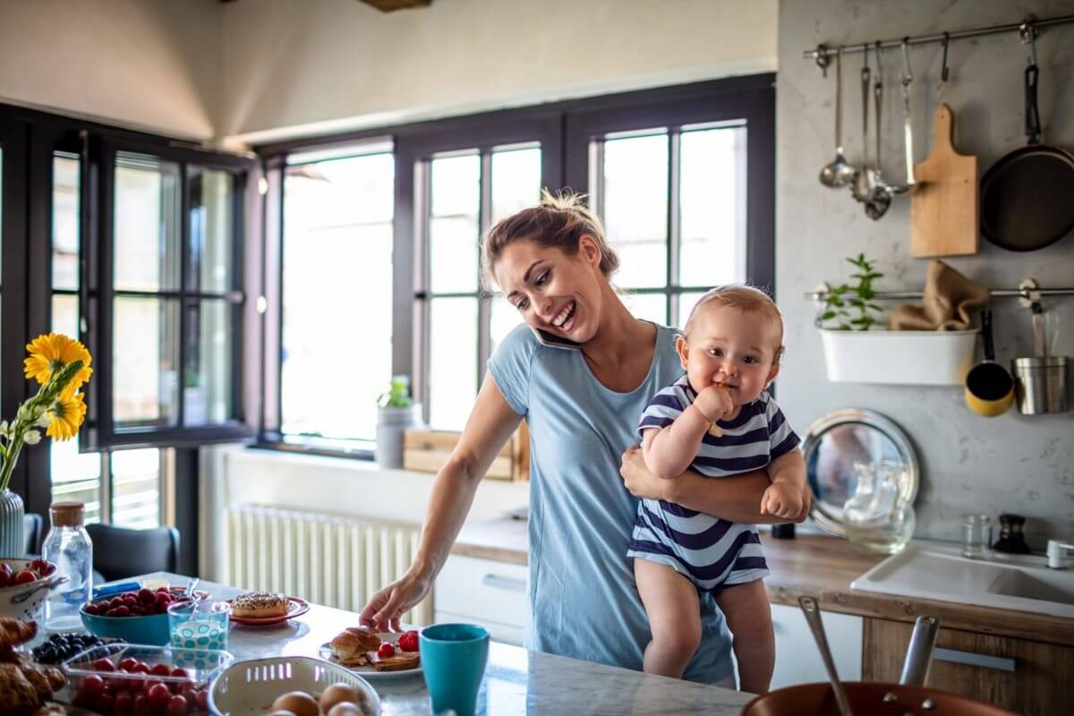 Busy Mother with Child in Kitchen