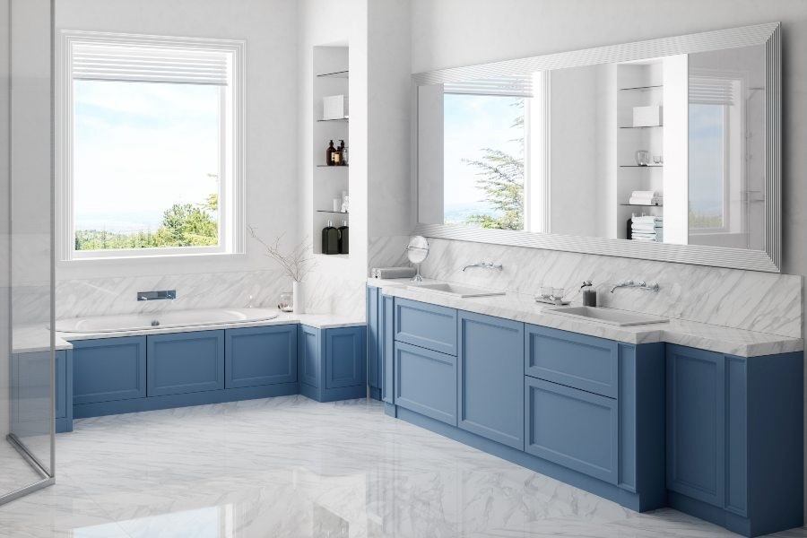 A bathroom with blue and white cabinets