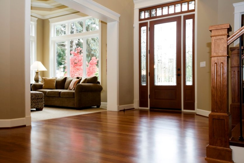 A living room with a wood floor