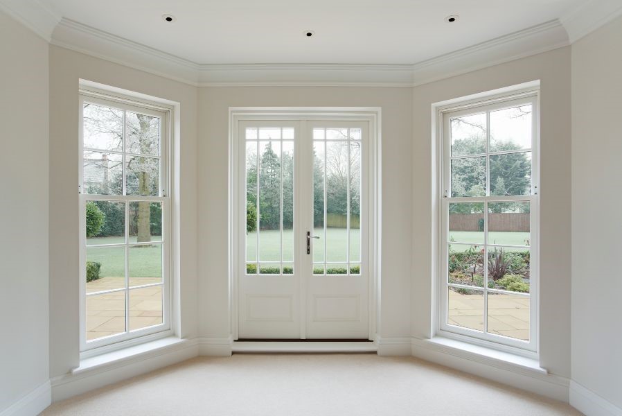 A room with white walls and windows