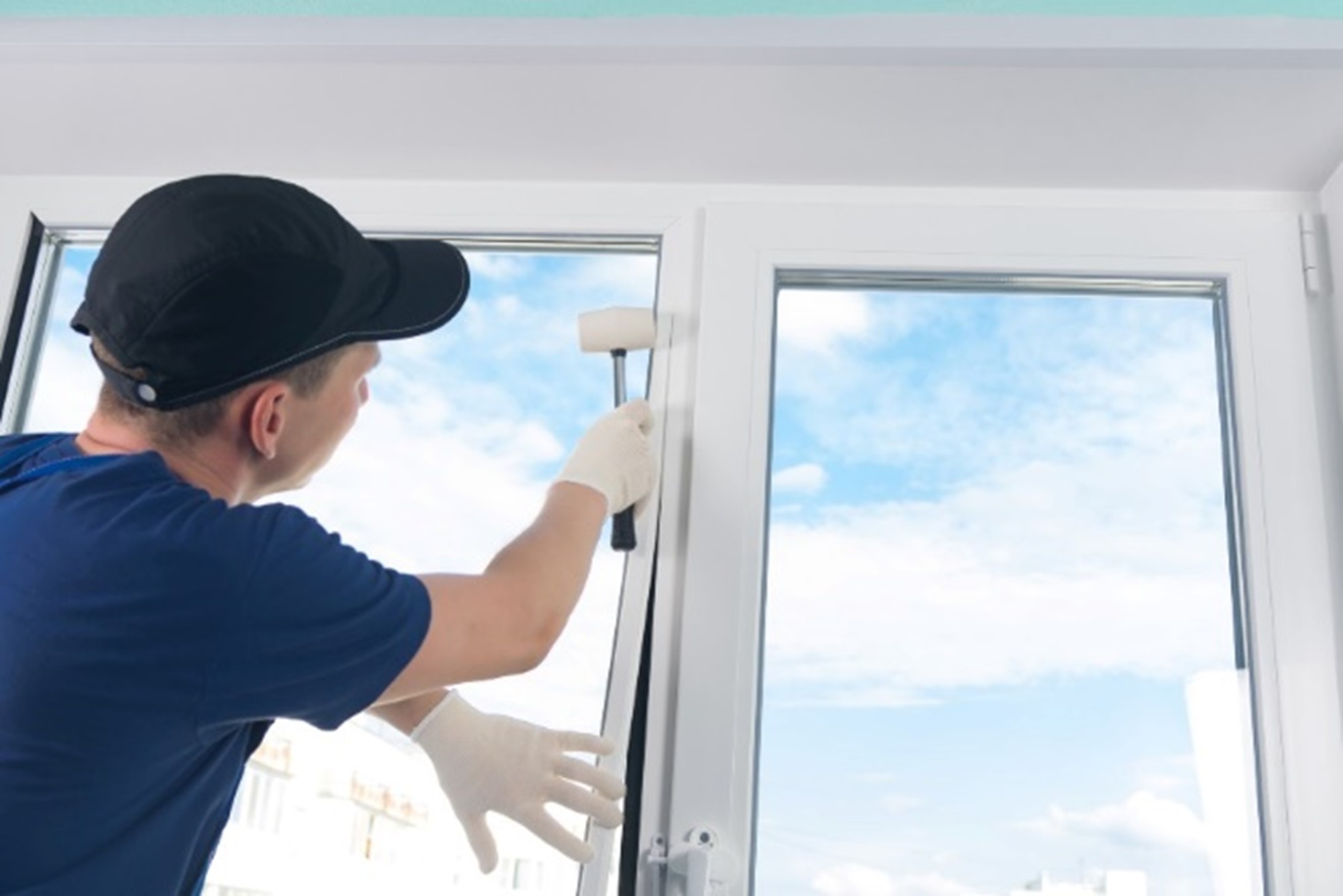 A person cleaning a window