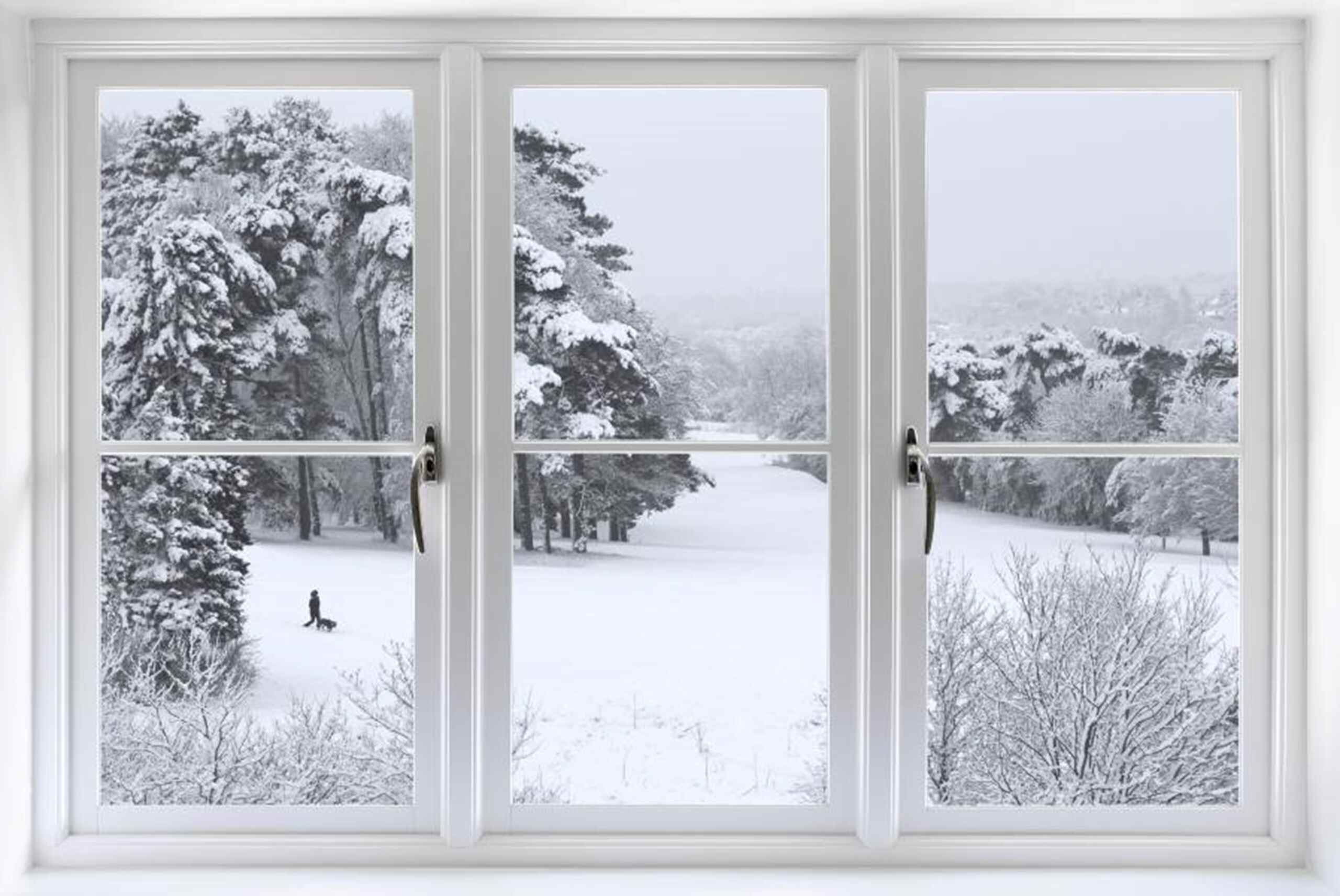 A window with a view of a snowy landscape