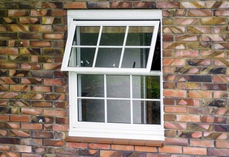 A close-up of an awning window against brick in Columbus, Ohio