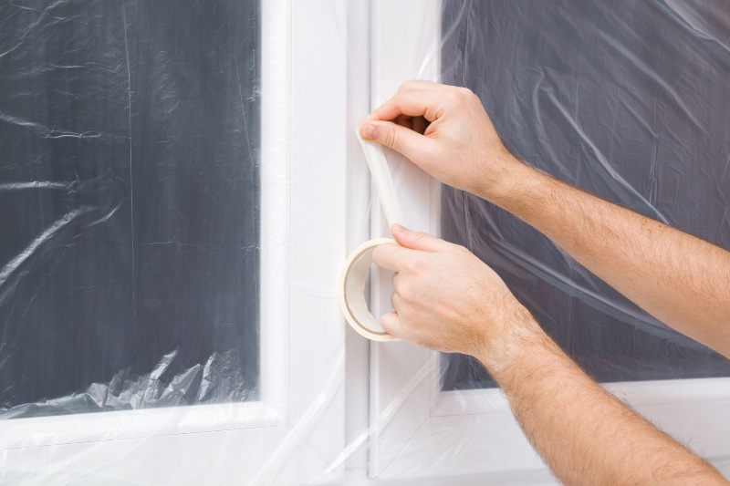 Applying plastic window insulation film