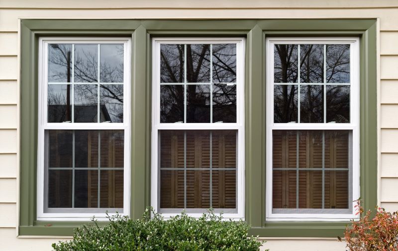 Newly installed double-hung windows with decorative grids